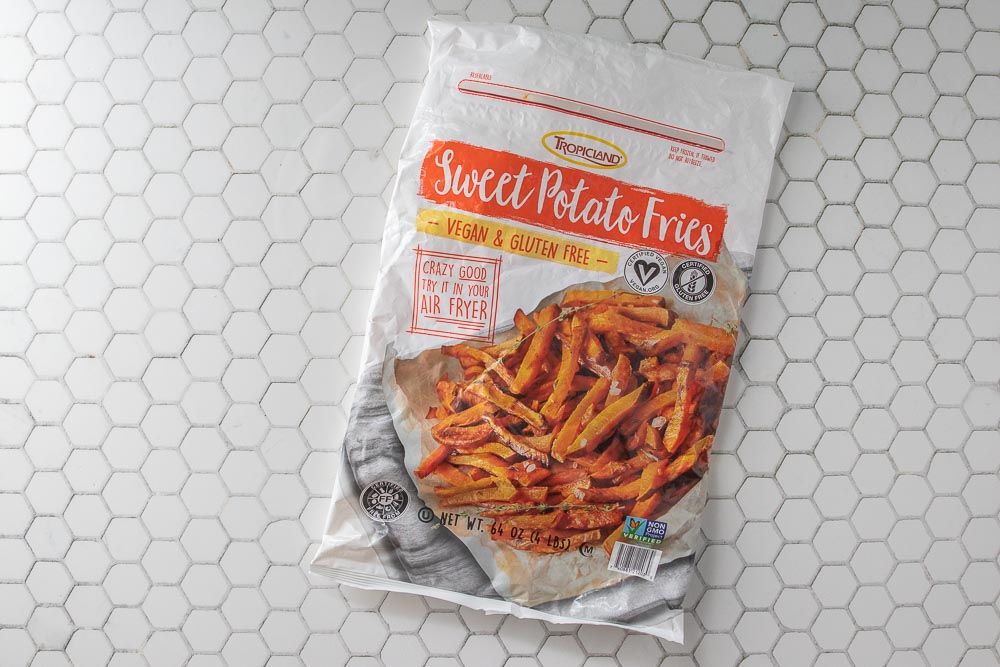 A bag of sweet potato fries on a counter.