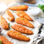 cooked buffalo chicken tenders on a tray