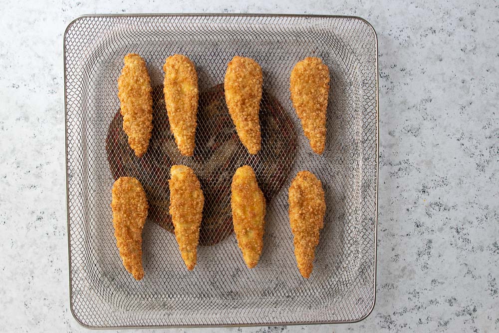 cooked tenders on air fryer wire tray