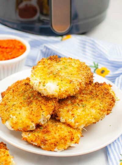 mozzarella slices cooked and on a serving plate