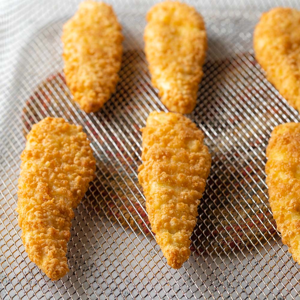 chicken tenders on an air fryer tray