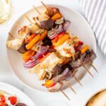 air fried chicken skewers with veggies on a plate